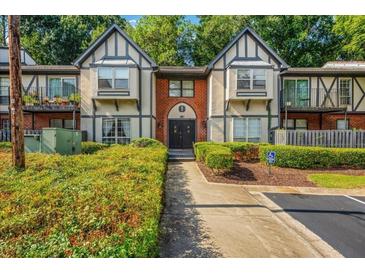 Brick building exterior with Tudor style and landscaping at 6851 Ne Roswell Ne Rd, Atlanta, GA 30328