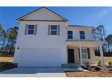 Two-story house with white siding, gray shutters, and a brick facade at 18 Loth Wages (Lot 18) Rd, Dacula, GA 30019