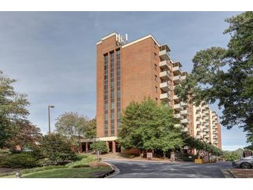 Brick building exterior with landscaping and parking at 300 Johnson Ferry Rd # B711, Atlanta, GA 30328