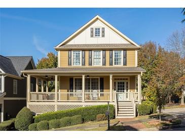 Two-story house with wraparound porch and landscaped yard at 976 Arthur Nw Ln, Atlanta, GA 30318