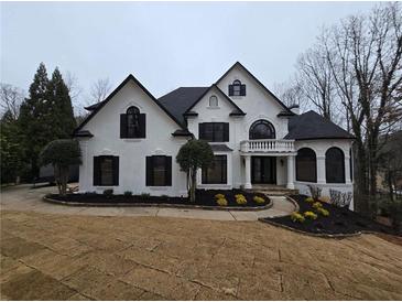 Stunning two-story home with black accents and manicured landscaping at 7910 Tintern Trce, Duluth, GA 30097