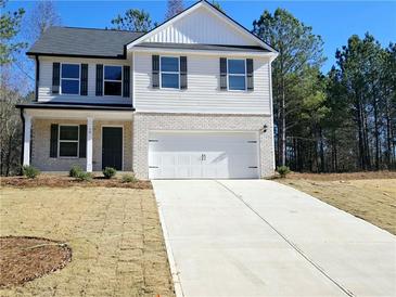 Two-story house with white siding, gray shutters, and a two-car garage at 15 Fontana Ct, Covington, GA 30016