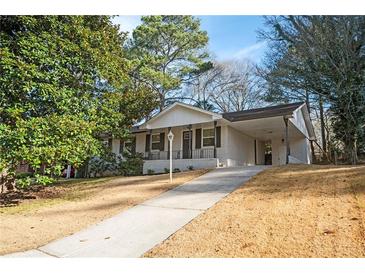 Newly renovated ranch home with modern exterior and landscaped yard at 2198 Star Mist Sw Dr, Atlanta, GA 30311