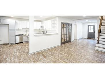 Modern kitchen with stainless steel appliances and white shaker cabinets at 2992 1St Sw Ave, Atlanta, GA 30315