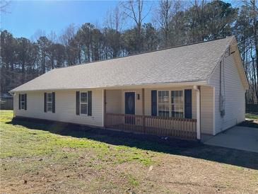 Newly constructed one-story home featuring a covered porch and a spacious yard at 435 Price Quarters Rd, Mcdonough, GA 30253