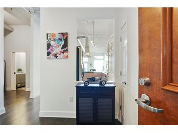 Bright entryway with hardwood floors, open view to kitchen, and modern accents at 3820 Roswell Ne Rd # 510, Atlanta, GA 30342