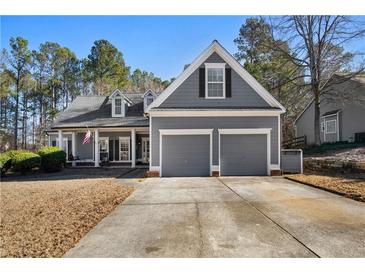 Gray house with two-car garage and a front porch at 422 Thunder Ridge Dr, Acworth, GA 30101