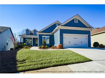 Charming blue home with white accents and a two-car garage at 405 Laurel Spring Ct, Canton, GA 30114