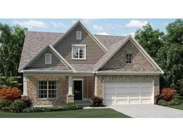 Two-story home with brick and siding exterior and a two-car garage at 190 Hickory Bluffs Pkwy, Canton, GA 30114