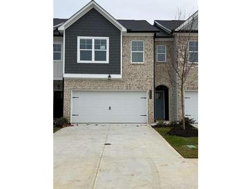 Brick and shingle two-story townhome with a two-car garage at 5599 Hislop Ln # 78, Mableton, GA 30126