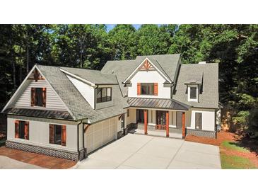 Two-story home with gray roof, white siding, and brown accents at 1840 Pilgrim Mill Cir, Cumming, GA 30041