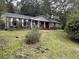 Brick ranch house with covered porch at 5297 Rock Springs Rd, Lithonia, GA 30038