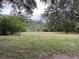 Wooded lot with grassy clearing, ready to build your dream home at 5297 Rock Springs Rd, Lithonia, GA 30038