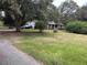 Brick ranch house with a large yard at 5297 Rock Springs Rd, Lithonia, GA 30038
