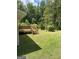 Landscaped backyard with wooden deck and green grass at 2628 Elks Club Rd, Covington, GA 30014