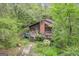 Aerial view of house nestled in a wooded area at 2421 Bethel Ne Rd, Conyers, GA 30012