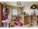 bedroom with crib, toys, and shelving at 2421 Bethel Ne Rd, Conyers, GA 30012
