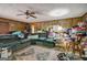 Large living room with cluttered furniture at 2421 Bethel Ne Rd, Conyers, GA 30012