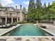 Large in-ground pool with brick spa and lounge chairs at 131 Burdette Rd, Atlanta, GA 30327