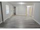 Spacious living area featuring light gray walls and wood-look flooring at 1333 Heather Cir, Riverdale, GA 30296