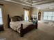 Main bedroom with a king-size bed and fireplace at 1995 Evergreen Se Dr, Conyers, GA 30013