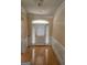 Bright entryway with hardwood floors and white door at 1995 Evergreen Se Dr, Conyers, GA 30013