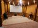 Home theater with large projection screen and seating at 1995 Evergreen Se Dr, Conyers, GA 30013