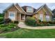 Two-story house with stone accents and landscaped yard at 1995 Evergreen Se Dr, Conyers, GA 30013