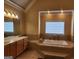 Bathroom features a large soaking tub and double sinks at 1995 Evergreen Se Dr, Conyers, GA 30013