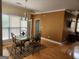 Bright dining room featuring a glass-top table and hardwood floors at 1995 Evergreen Se Dr, Conyers, GA 30013