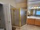 Elegant bathroom with a corner shower and double vanity at 1995 Evergreen Se Dr, Conyers, GA 30013