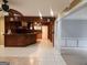 Basement bar with dark wood cabinets and tile flooring at 1995 Evergreen Se Dr, Conyers, GA 30013
