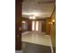 Living room with wood paneling, tile floor, and ceiling fan at 6470 Connell Rd, South Fulton, GA 30349