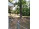 Large backyard with mature trees and stone accents at 6470 Connell Rd, South Fulton, GA 30349