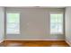 Bright bedroom with hardwood floors and two large windows at 1142 Windsor Sw St, Atlanta, GA 30310