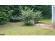 Small backyard with a bush and a patio at 25 Shady Oaks Trl, Covington, GA 30016