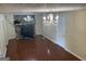 Living room with stone fireplace and hardwood floors at 5878 Nell Ln, Ellenwood, GA 30294