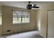 Bright bedroom with window, ceiling fan and closet at 5878 Nell Ln, Ellenwood, GA 30294