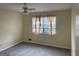 Bedroom with window, ceiling fan and carpet at 5878 Nell Ln, Ellenwood, GA 30294