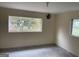 Simple bedroom with large window and tile flooring at 5878 Nell Ln, Ellenwood, GA 30294