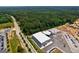 Aerial view of a modern warehouse with unique mural art and parking at 557 Veterans Pkwy, Fayetteville, GA 30214