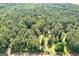 Large wooded lot with a long driveway, perfect for building your dream home at 557 Veterans Pkwy, Fayetteville, GA 30214
