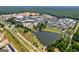 Aerial perspective of a new development, featuring a lake and residential homes at 557 Veterans Pkwy, Fayetteville, GA 30214