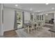 Bright dining room featuring a table with chairs and built-in hutch at 4505 Cochran Mill Rd, Fairburn, GA 30213