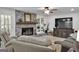 Living room with a brick fireplace, large TV, and comfortable seating at 4505 Cochran Mill Rd, Fairburn, GA 30213