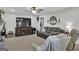 Spacious living room with a large TV, comfortable seating, and ceiling fan at 4505 Cochran Mill Rd, Fairburn, GA 30213