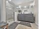 Modern bathroom with gray vanity, glass shower, and elegant tile at 4505 Cochran Mill Rd, Fairburn, GA 30213