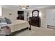 Main bedroom with a large bed, dresser, and walk-in closet at 4505 Cochran Mill Rd, Fairburn, GA 30213