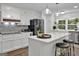 Bright kitchen features white cabinets, an island, and stainless steel appliances at 4505 Cochran Mill Rd, Fairburn, GA 30213