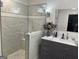 Updated bathroom featuring a large glass shower and gray vanity at 4505 Cochran Mill Rd, Fairburn, GA 30213